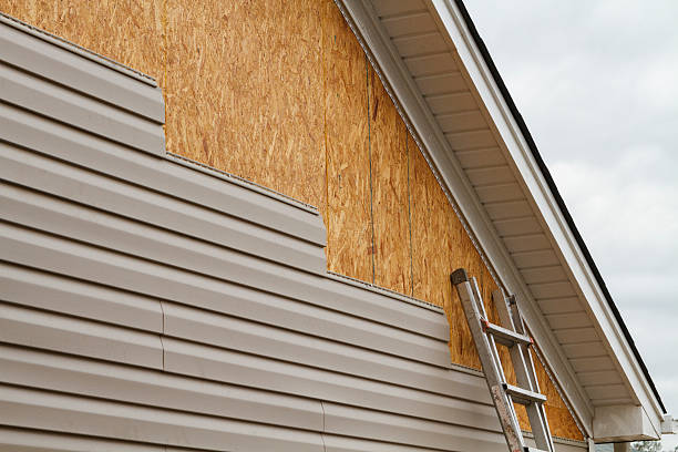 Professional Emergency Siding Repair technician working in Warren, PA